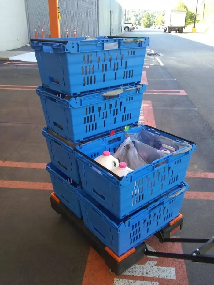 blue boxes stacked full of groceries