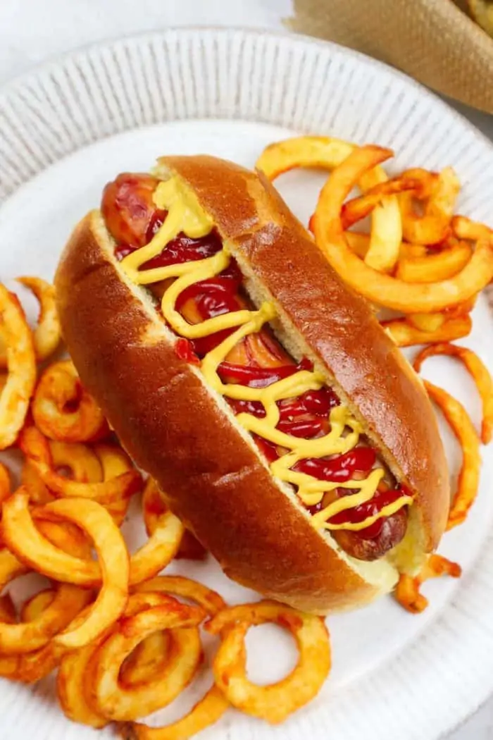 A hot dog and fries on a plate