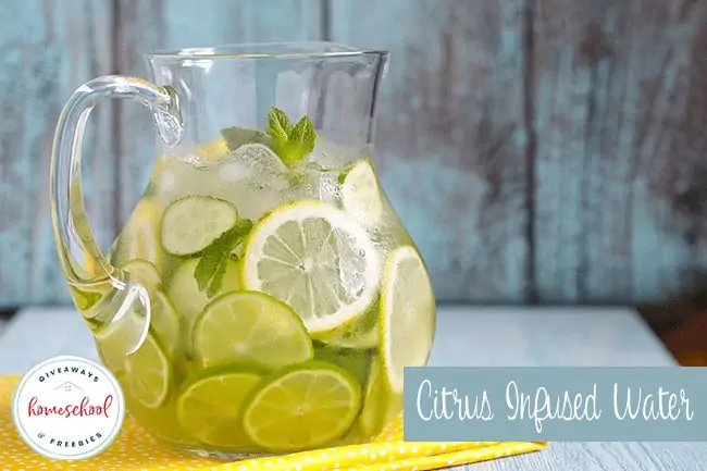 Citrus Infused Water text with image of a pitcher full of water and lemon and lime slices