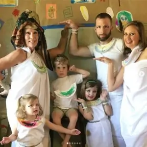 A picture of a family playing dress up as Egyptians
