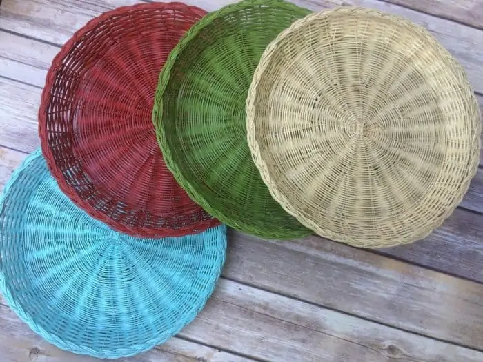 different colored spray painted wicker baskets