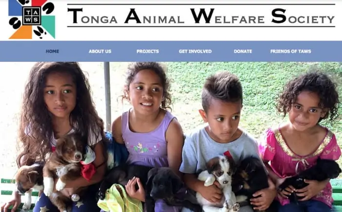 Tonga Animal Welfare Society text with image of kids holding puppies