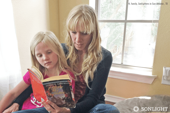 mom reads to daughter