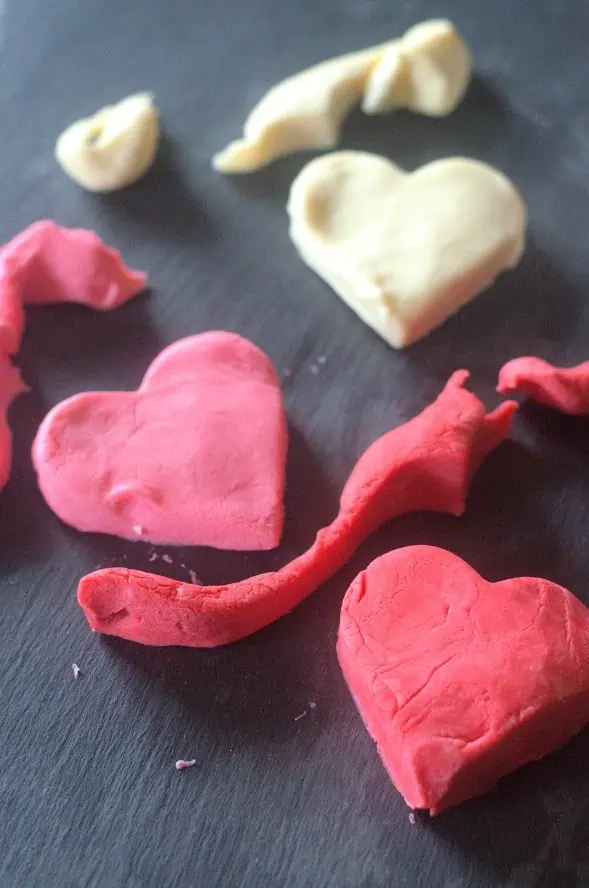red and white playdough heart shapes.