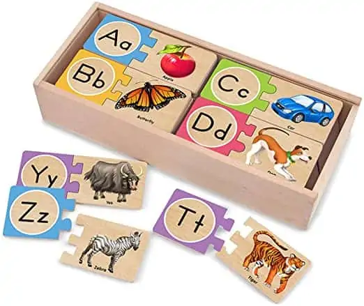 This image is of the wooden storage box and self-correcting alphabet puzzle game pieces.