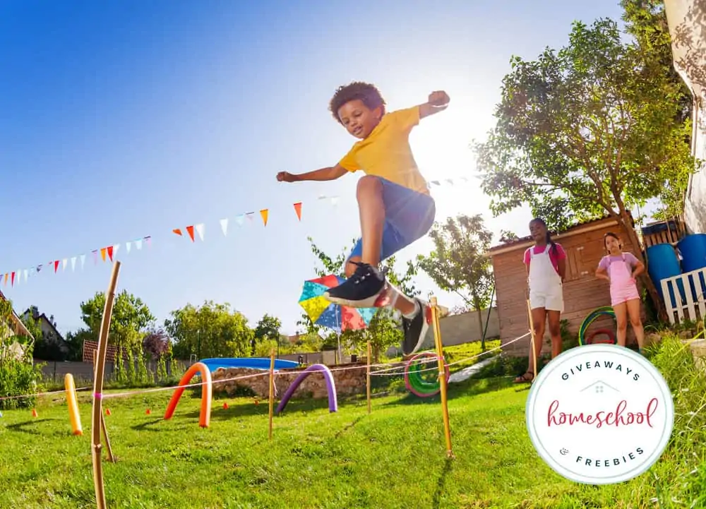 boy jumping in an obstacle course