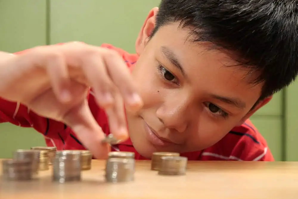 boy counting coins