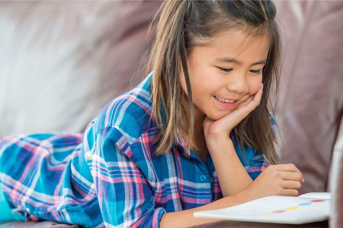 Dear Canada books in order showing girl smiling while reading