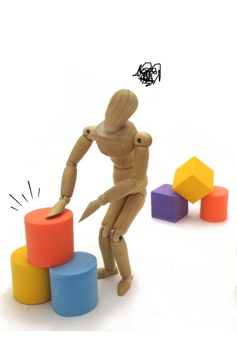best adhd planner image shows wooden figure stacking 3 cylinders