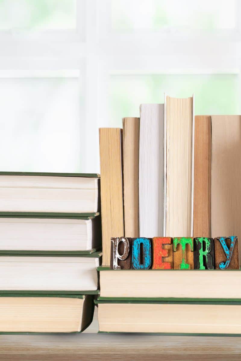 poetry in your homeschool includes pile of books with poetry sign